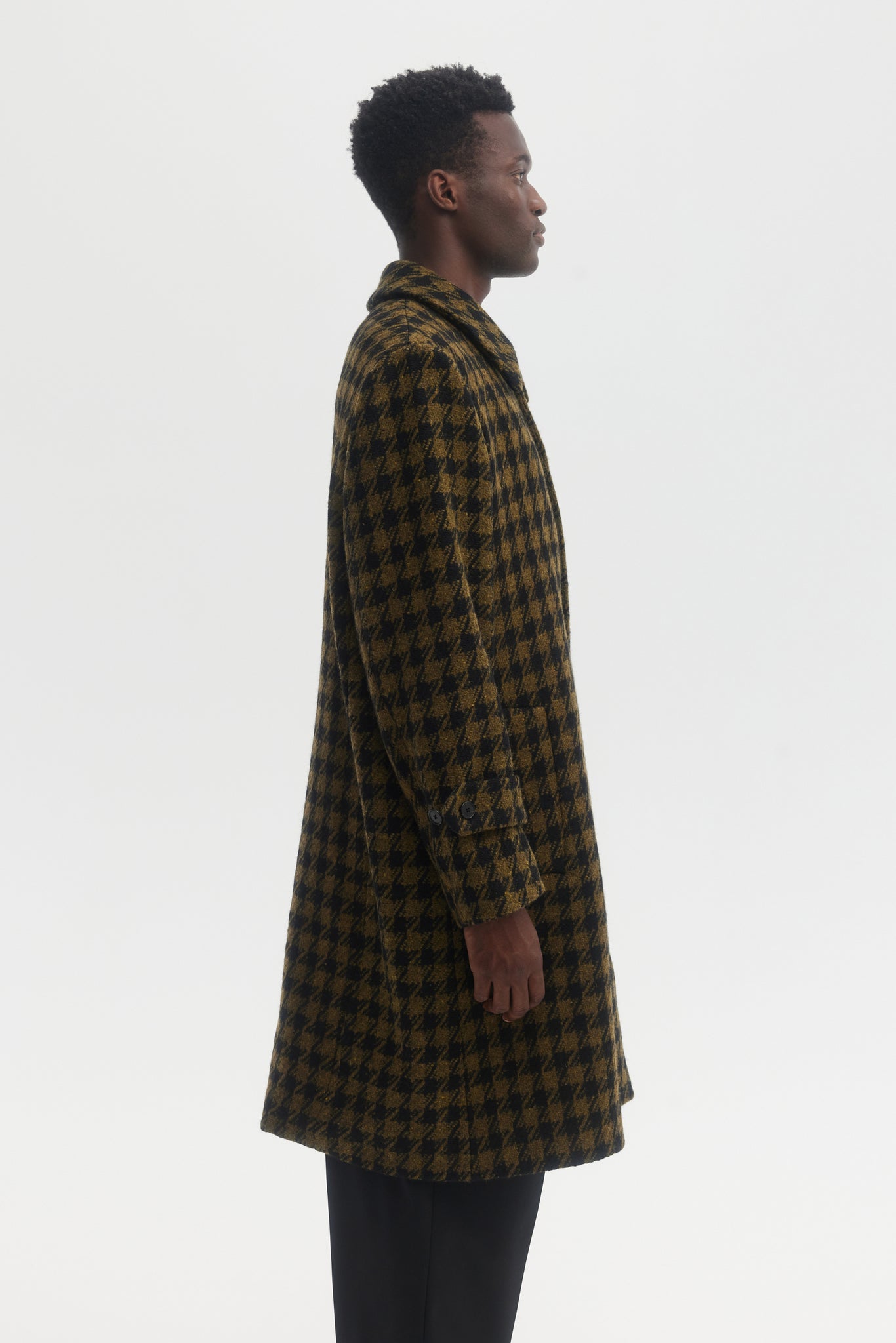 Black and green dogtooth wool overcoat