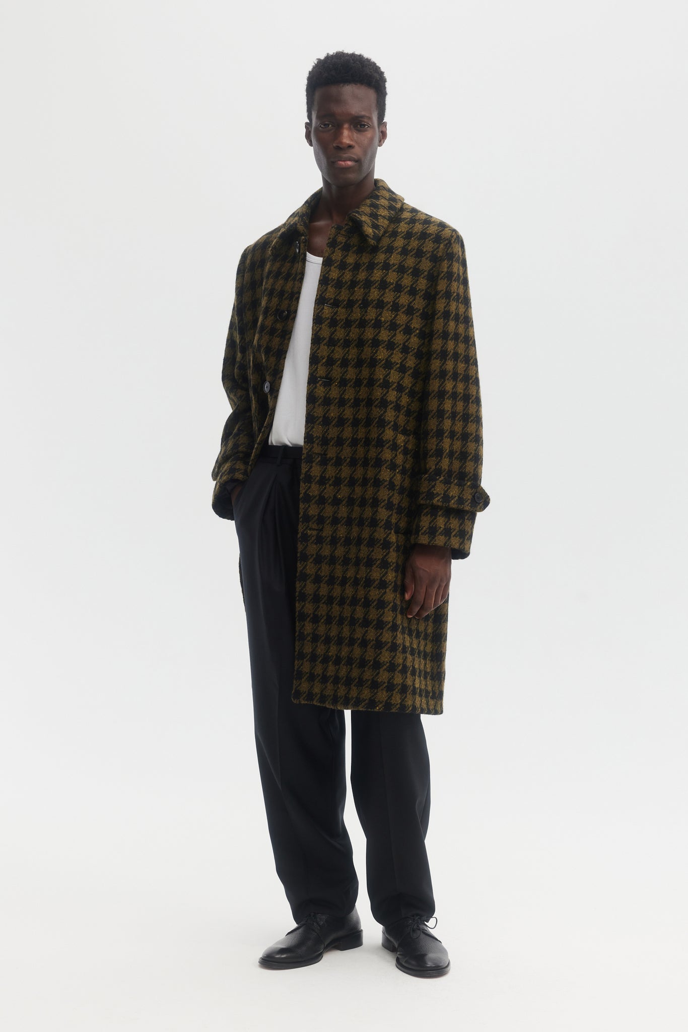 Black and green dogtooth wool overcoat